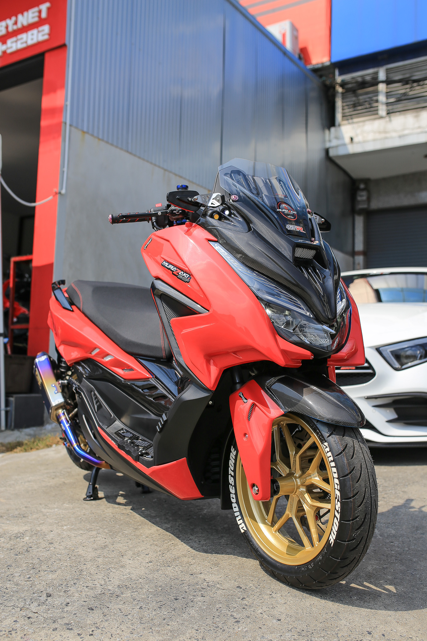 กระจกยึดข้างชิวหน้าพร้อมขายึดสแตนเลส Revolution