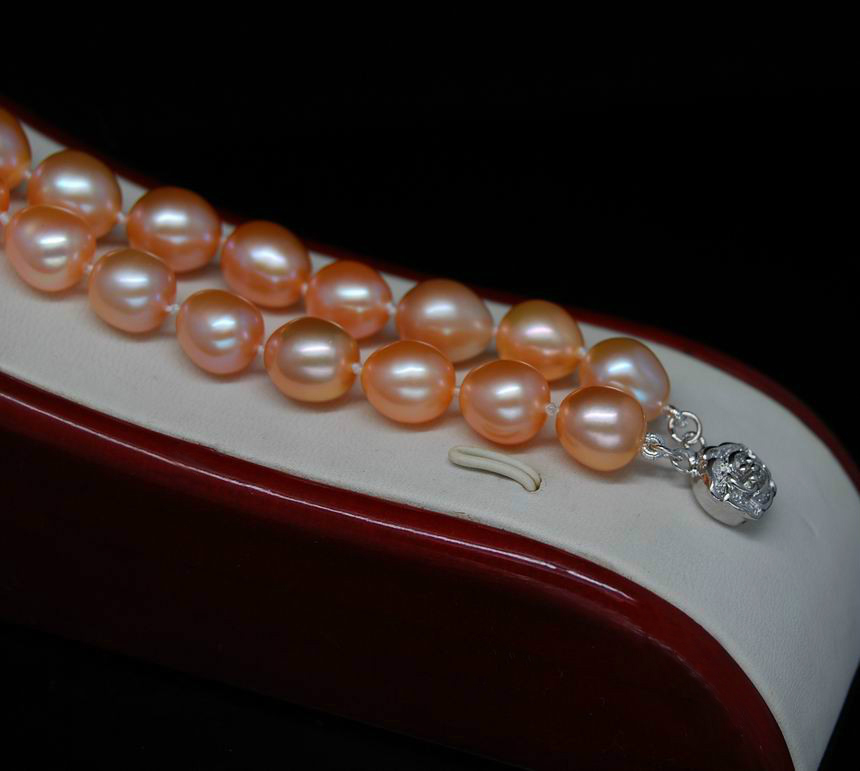 สร้อยข้อมือไข่มุกแท้ แบบ 2 ชั้น มุกรี สีส้ม 8.5x9 มิล