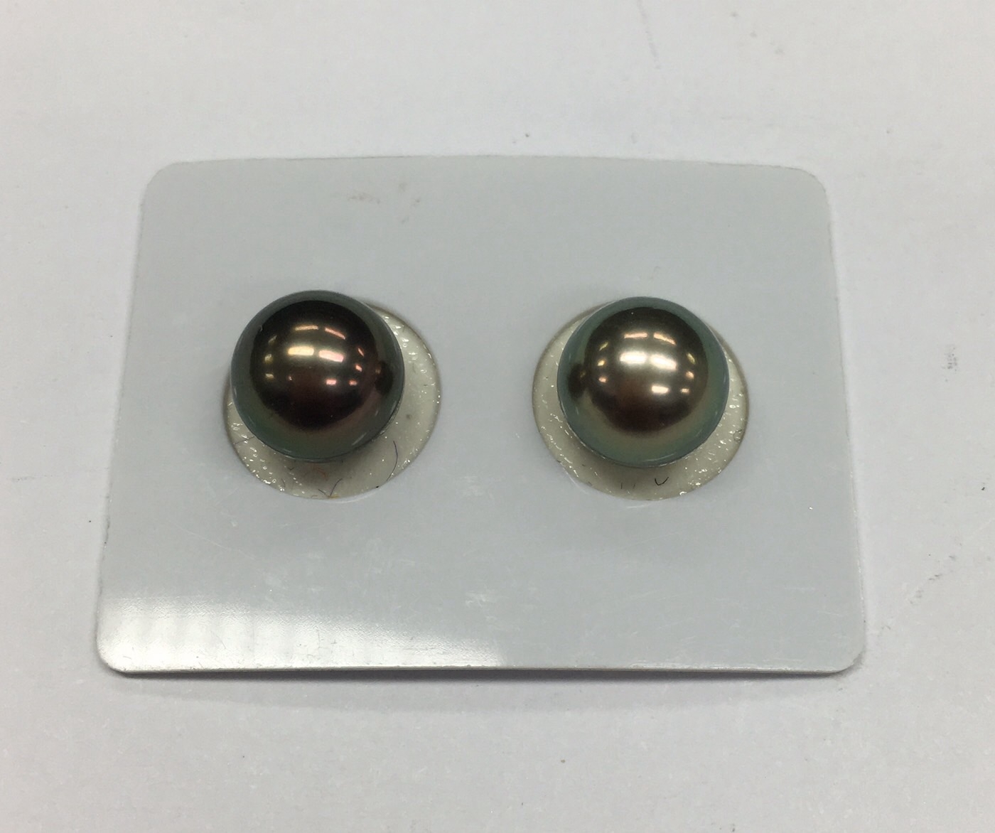 ไข่มุกเม็ดคู่ south sea ขนาด 10-11 มิล กลม สีดำอมเขียวเข้ม สีเกรด AAA