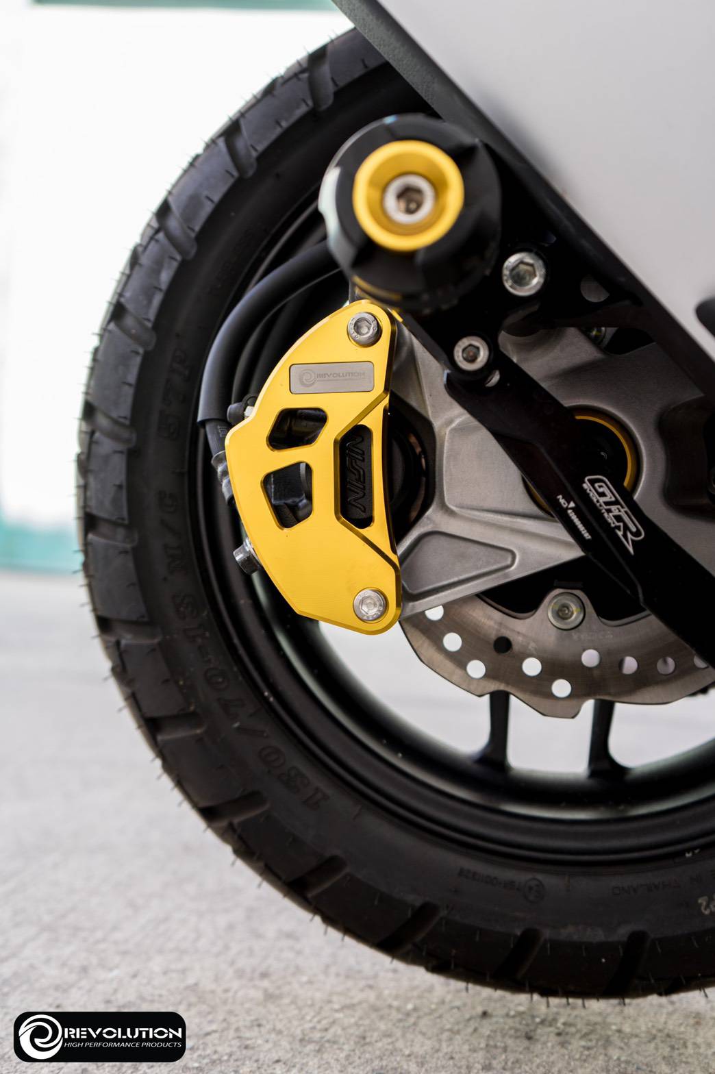 การ์ดปั้มดิสหลังล่าง REVOLOTION ADV150