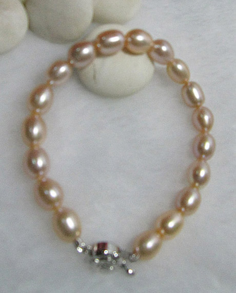 ชุดไข่มุกแท้ สร้อยคอ และ สร้อยข้อมือเม็ดรี 7x8.5 มิล สีส้ม