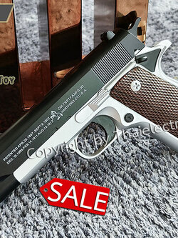 ปืนอัดลมเหล็ก Colt 1911 ขนาดเล็ก ชักยิงทีล่ะนัด สีทูโทน ลำกล้องยาว 6.5 นิ้ว นกสับได้ เซพตี้สไลน์ หนัก 371 กรัม ใช้ลูกกระสุนพลาสติก 6 มิล