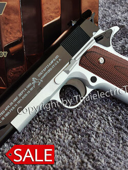 ปืนอัดลมเหล็ก ชักยิงทีล่ะนัด Colt 1911 สีทูโทน ลำกล้องยาว 7.5 นิ้ว นกสับได้ เซพตี้สไลน์ แมคเหล็ก หนัก 588 กรัม ใช้ลูกกระสุนพลาสติก 6 มิล