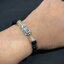 สร้อยข้อมือหินนิลแท้ 6MM และหินไหมทองประกบข้างปี่เซี๊ยะเงินแท้ Sterling Silver 925 NSBL2485