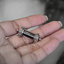 ปลอกตะกรุดเงินแท้ ลายดอกบัว พร้อมเลี่ยมพลาสติกกันน้ำ ขนาด 8MM NSSV2967