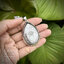 เหรียญหลวงปู่มหาศิลา สิริจันโท จ.กาฬสินธุ์ ๒๕๖๗ เลี่ยมจับขอบผ่าหวาย พลาสติกกันน้ำ Sterling Silver 925 NSSV3361
