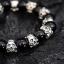 ข้อมือหินนิล ผิวเงา สลับลูกปัดหัวกะโหลกกระดูกไขว้ Sterling Silver 925 NSSK1677
