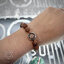 ข้อมือรุทรักษะ 10mm พร้อมเหรียญหน้าเสือ แท้จากวัดเกริ่นกฐิน ลพบุรี NSSV3192